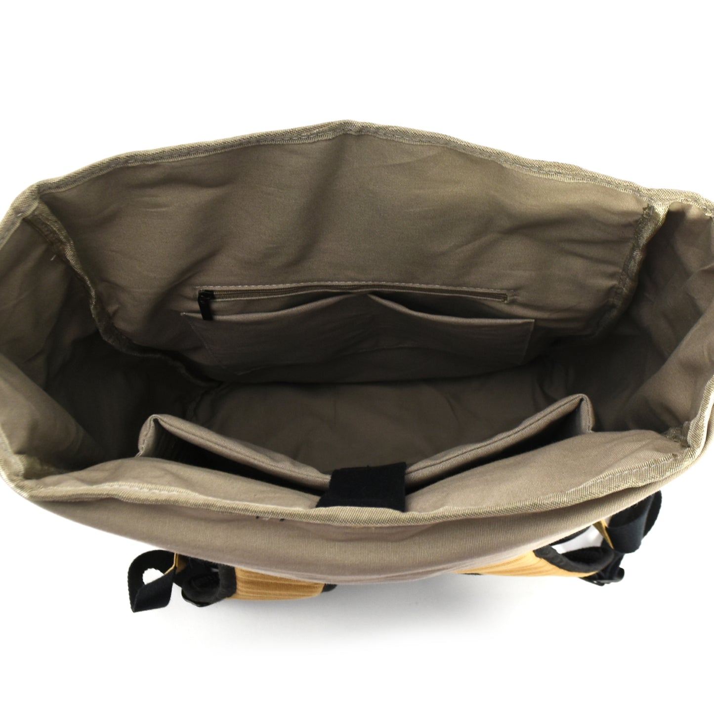 Above view of Seaside Kraft Paper Laptop Backpack showing the inside, revealing its organized compartments and practical storage for daily essentials.