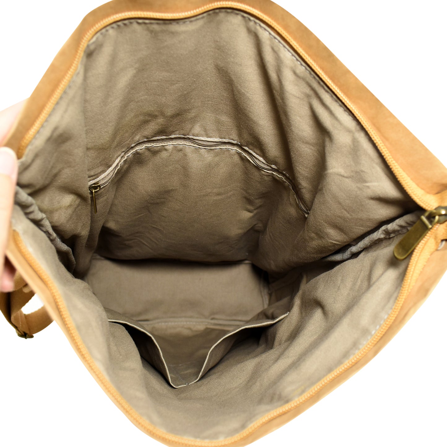 Mate Kraft Paper Backpack shown open from above, revealing its spacious interior and organization options for daily necessities.