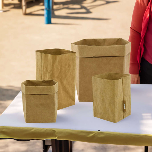 Sewo Kraft Paper Storage Bag Set shown on a table with a sunny day background, highlighting the eco-friendly and durable design of the bags in a bright, natural setting.