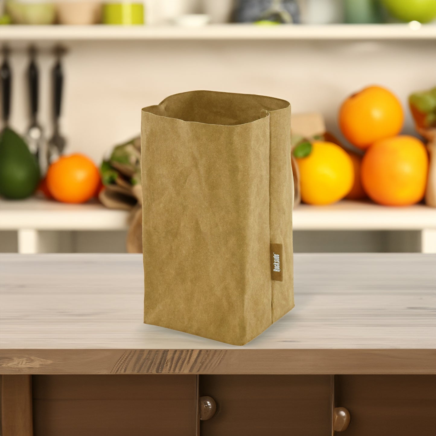 Sewo Kraft Paper Storage Bag – Medium shown on a kitchen bench with vegetables in the background, highlighting its eco-friendly design and functional storage capacity."